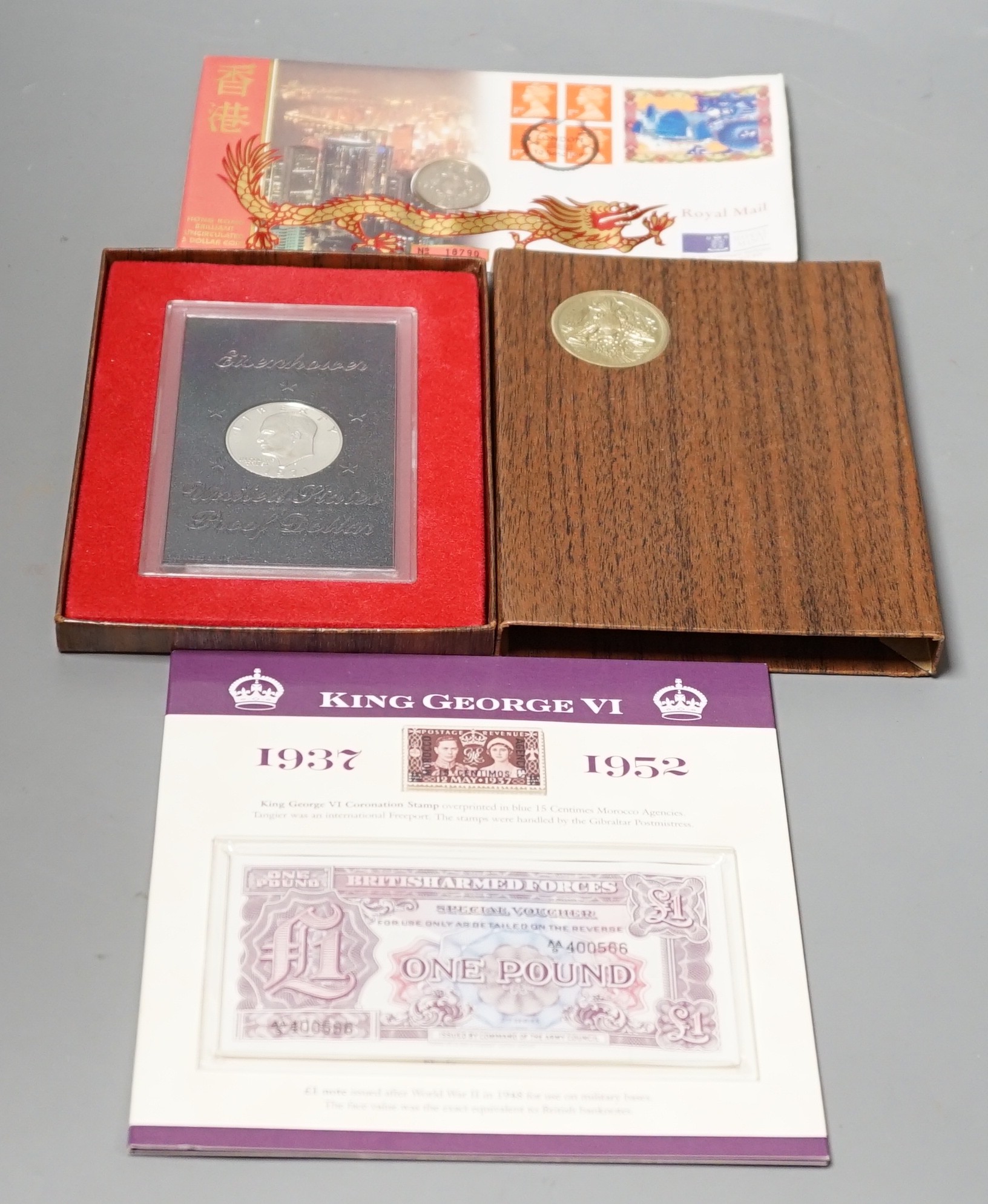 A group of QEII Royal Mint coin years sets, commemorative crowns, £5, £2 and George VI stamp, British Armed Forces £1 and coin set